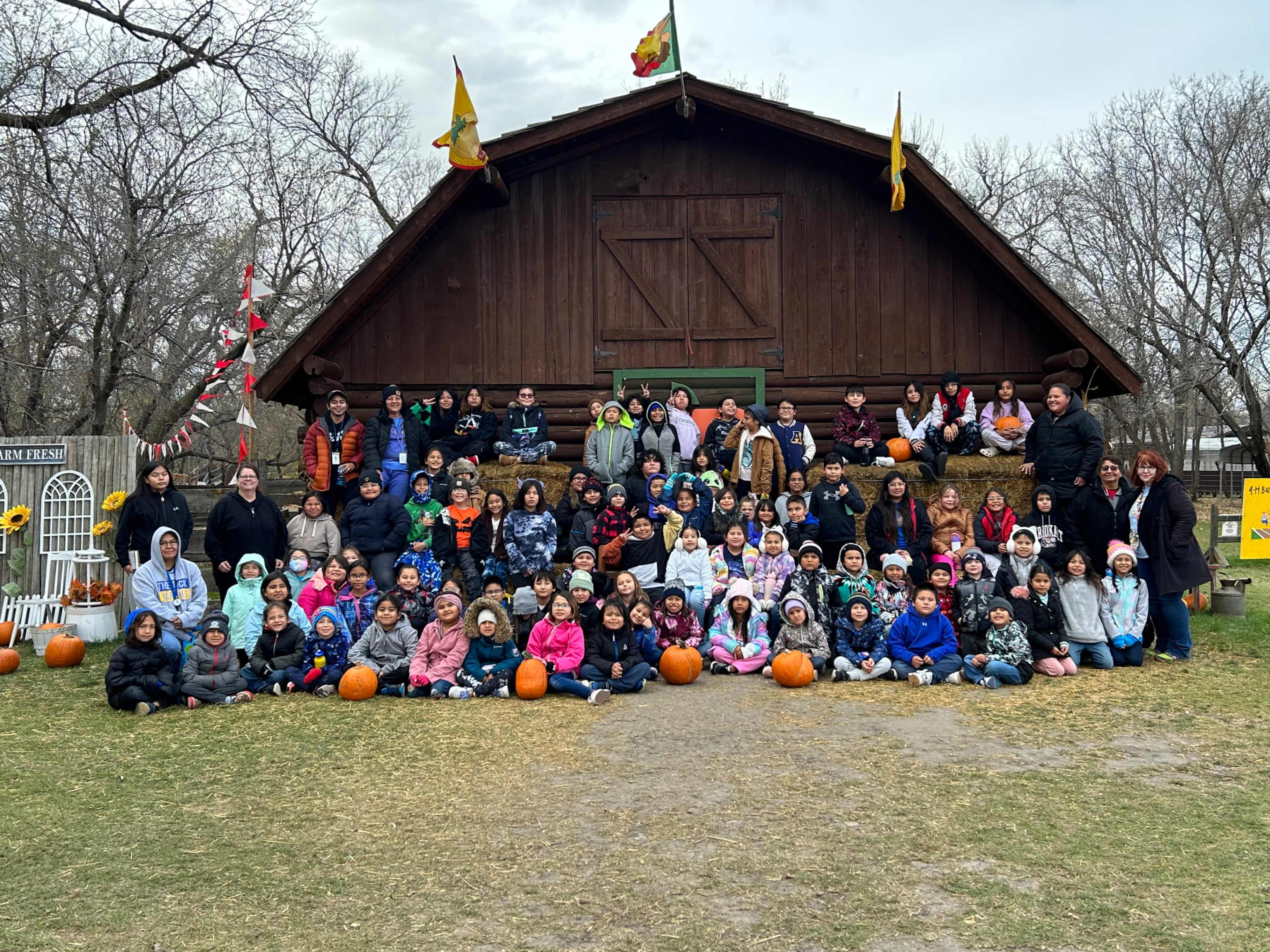 Students in front of a barn